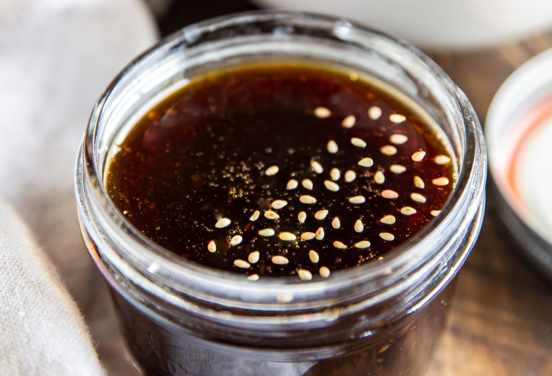 A glass jar of homemade teriyaki sauce.