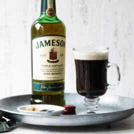 A tray with Irish Coffee and a bottle of Jameson Irish whiskey.