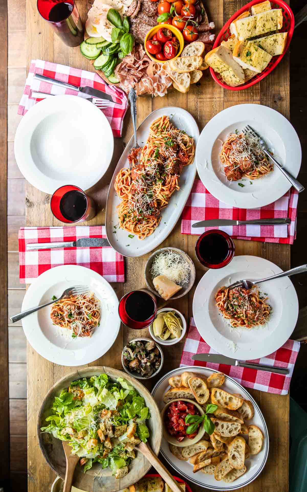 A spread of Italian food on a wooden table.