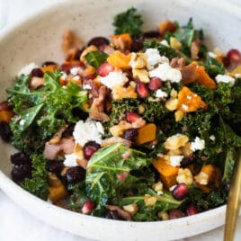 A white bowl filled with kale salad.