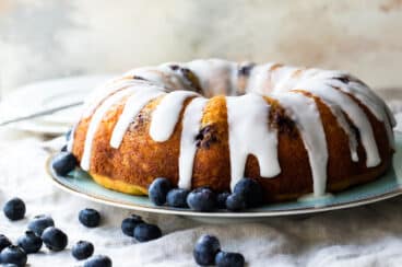Lemon Blueberry cake on a light blue plate.