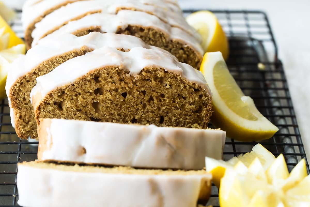 Lemon olive oil cake on a cooling rack.