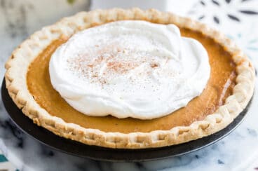 Make ahead pumpkin pie topped with whipped cream.