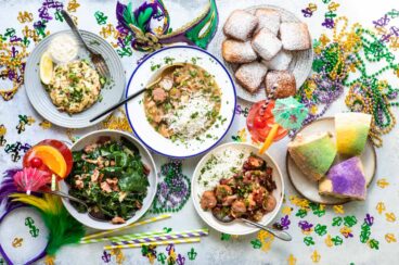 A table filled with various Mardi Gras food.