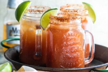 Three Micheladas on a metal tray.