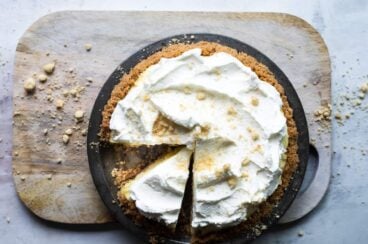 A millionaire pie on a wooden cutting board.
