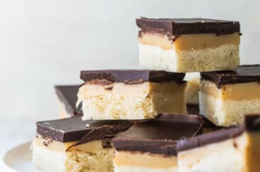 Squares of millionaire's shortbread on a plate.