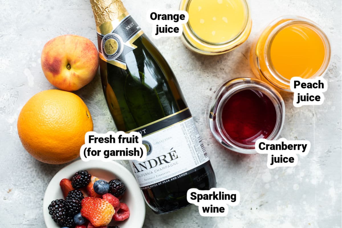 Ingredients for a mimosa bar labeled.