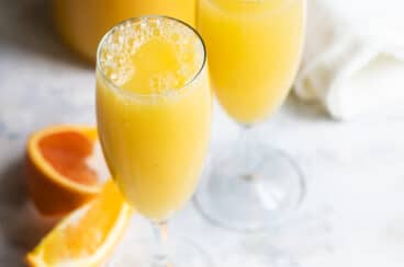 A mimosa cocktail in a champagne flute.