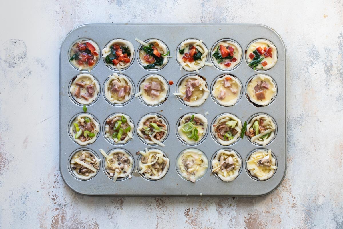 Mini quiche built in a mini muffin tin.