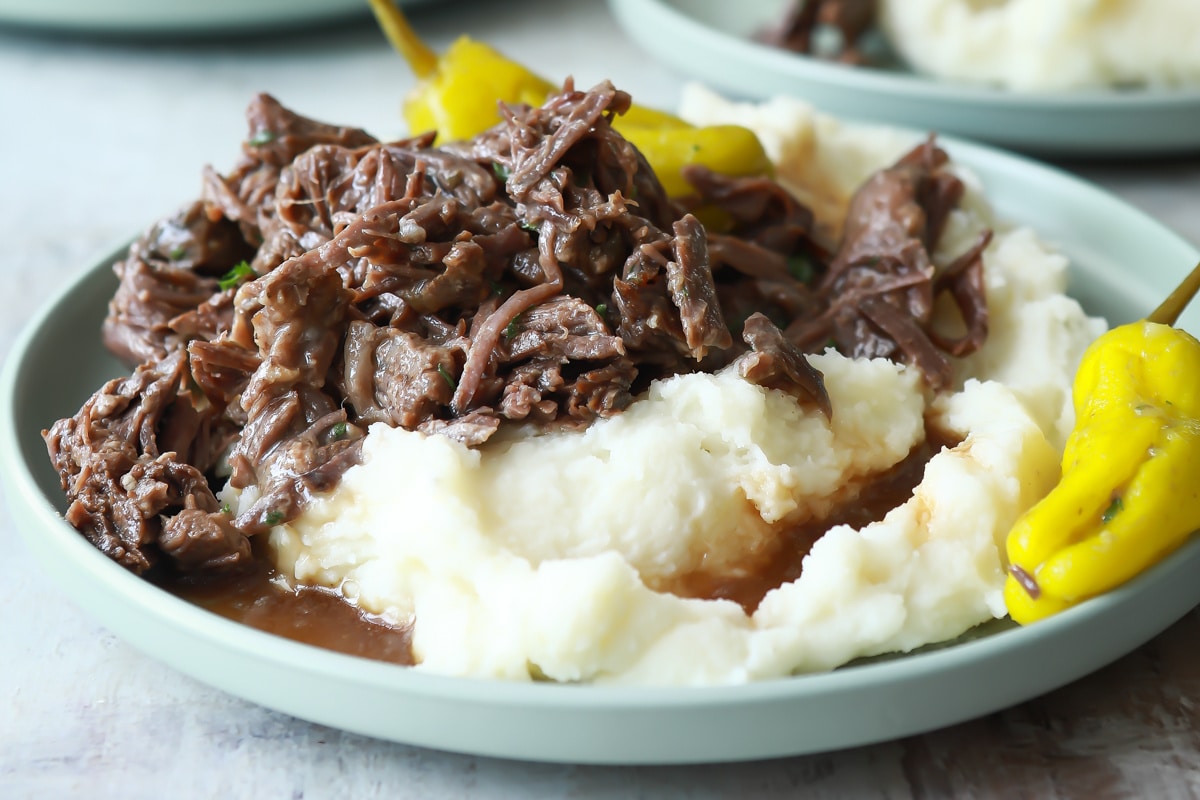 Mississippi pot roast over potatoes with gravy.