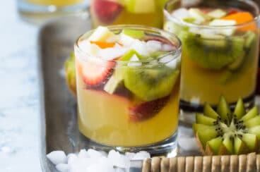 Moscato sangria in glasses on a serving tray.