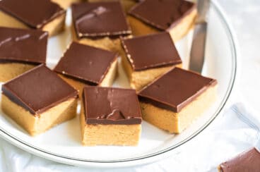 A plate of cut no-bake peanut butter bars.