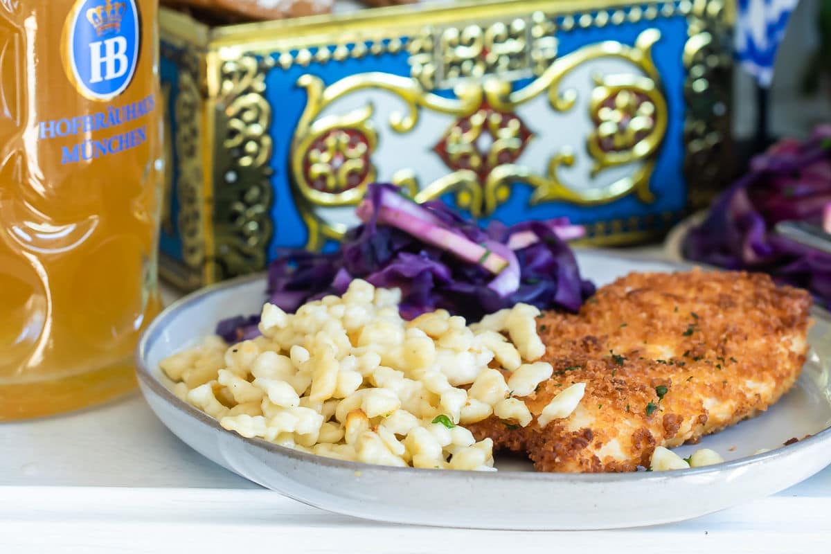 A plate of schnitzel, spaetzle, and braised red cabbage.