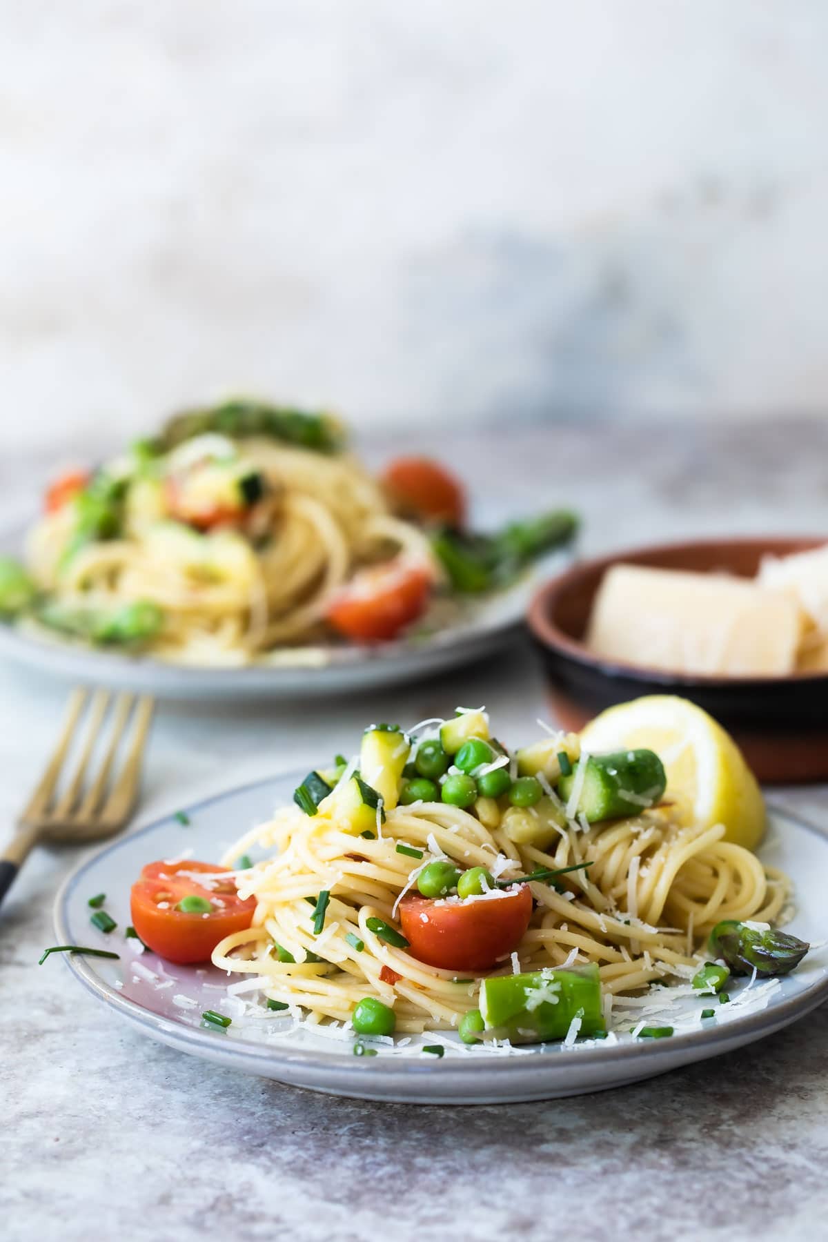 Two plates of Pasta Primavera.