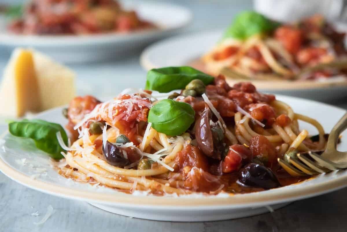 Plates of pasta puttanesca.