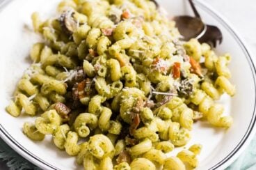 Pesto cavatappi on a white platter.