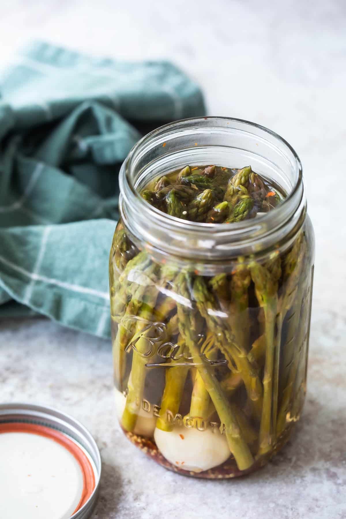 A jar of pickled asparagus.