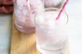 Pink lemonade vodka slush in a short clear glass.