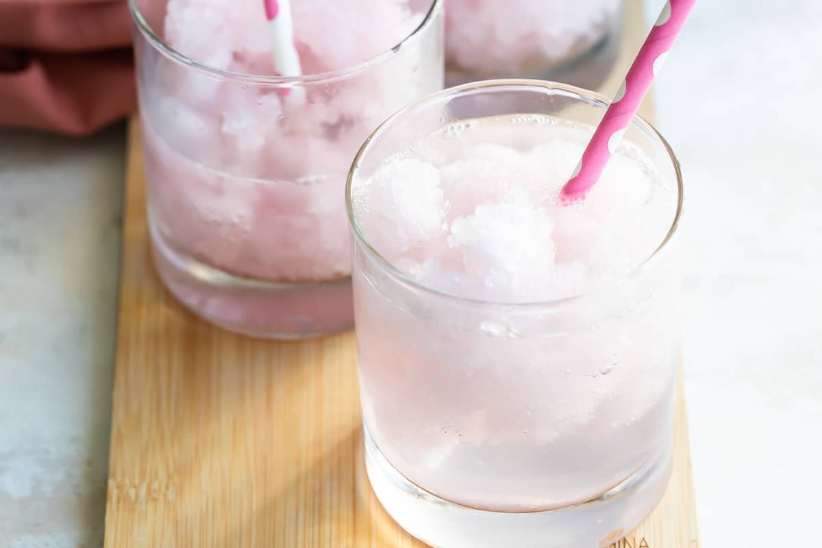Pink lemonade vodka slush in a short clear glass.