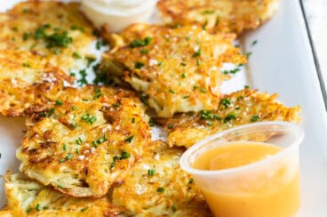 Potato latkes on a rectangular platter.