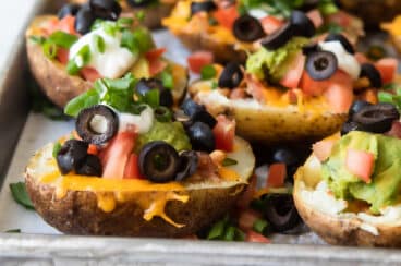 Potato skins on a baking sheet.