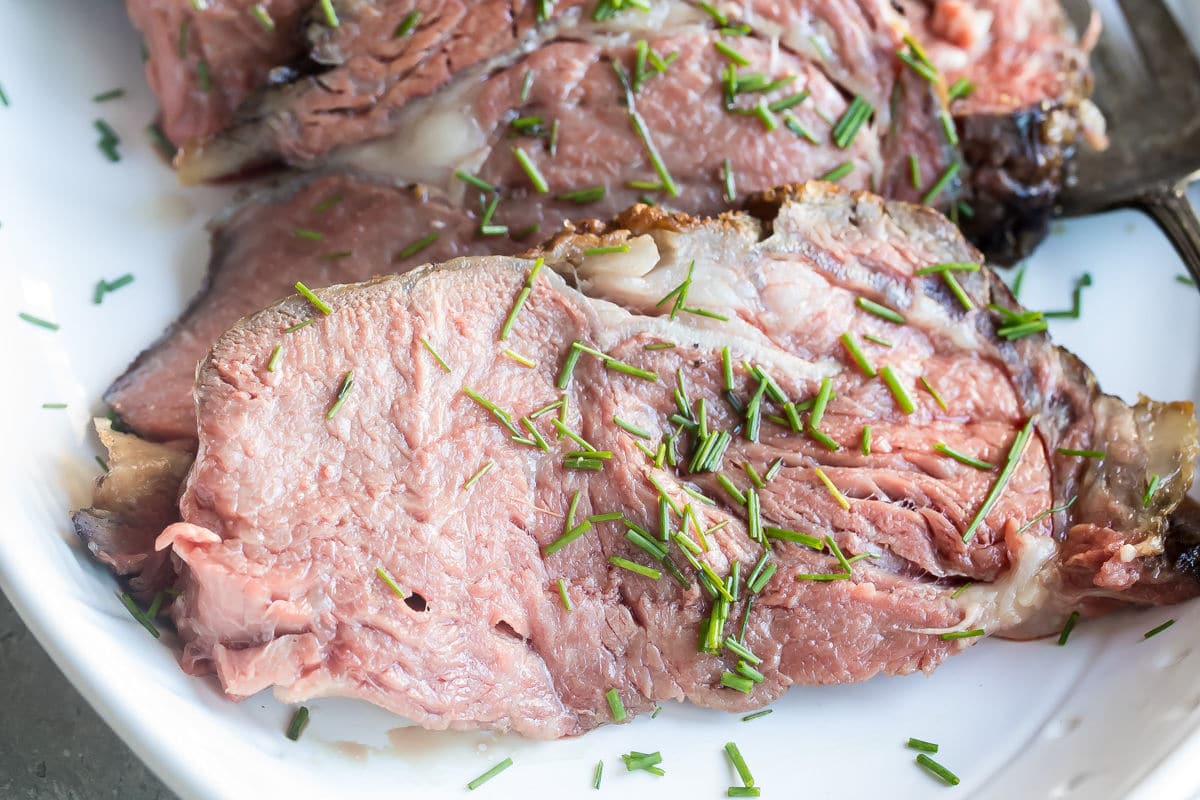 A platter of sliced prime rib.