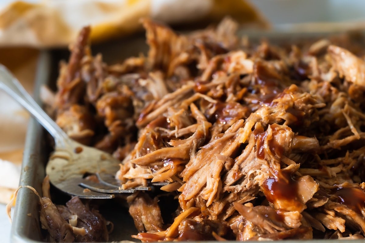 Pulled pork on a baking sheet.