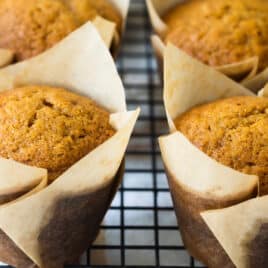 Pumpkin muffins on a cooling rack.