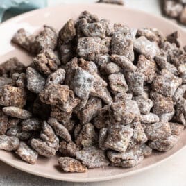 Puppy chow on a beige platter.