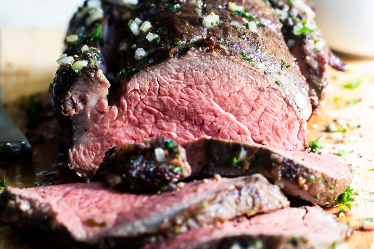 A sliced roast beef tenderloin.