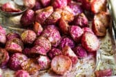Roasted radishes on a baking sheet.