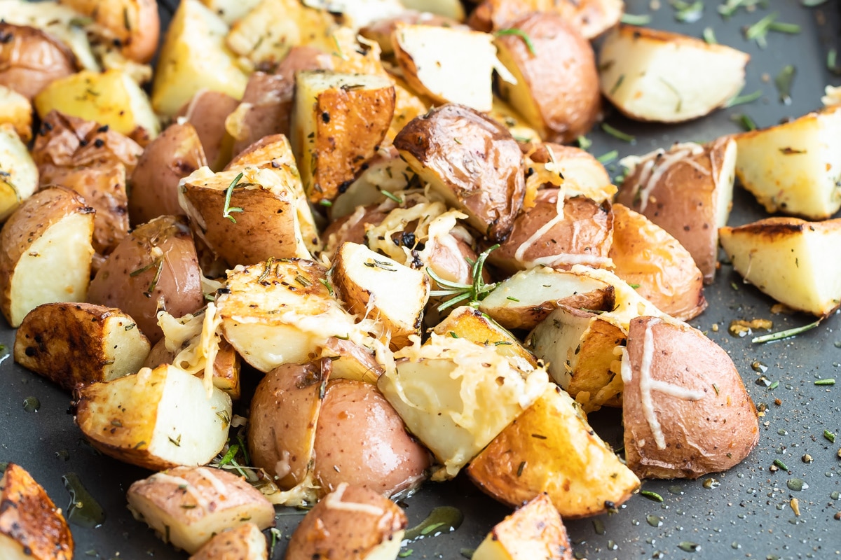 Roasted rosemary potatoes on a baking sheet.