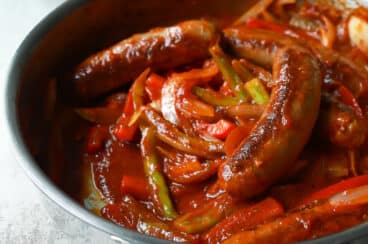 A skillet of sausage and peppers.