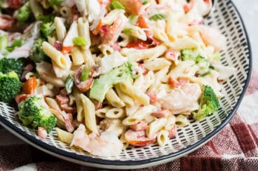 Seafood salad on a black and white platter.