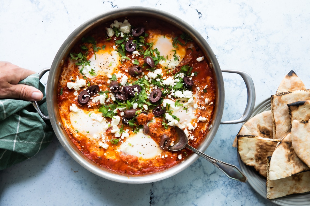 Shakshouka in a silver pan.