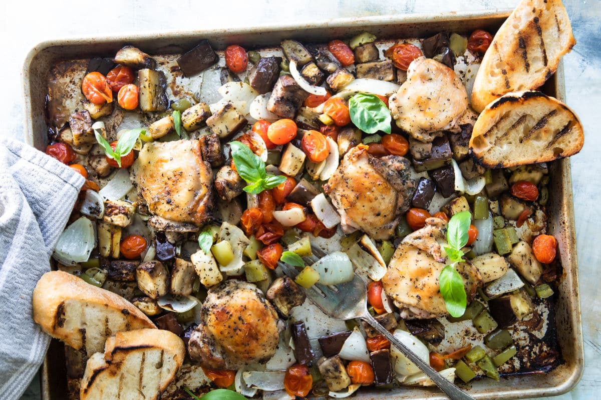 Italian-flavored roasted chicken on a sheet pan with veggies.