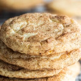 A stack of Snickerdoodle cookies on a baking rack.