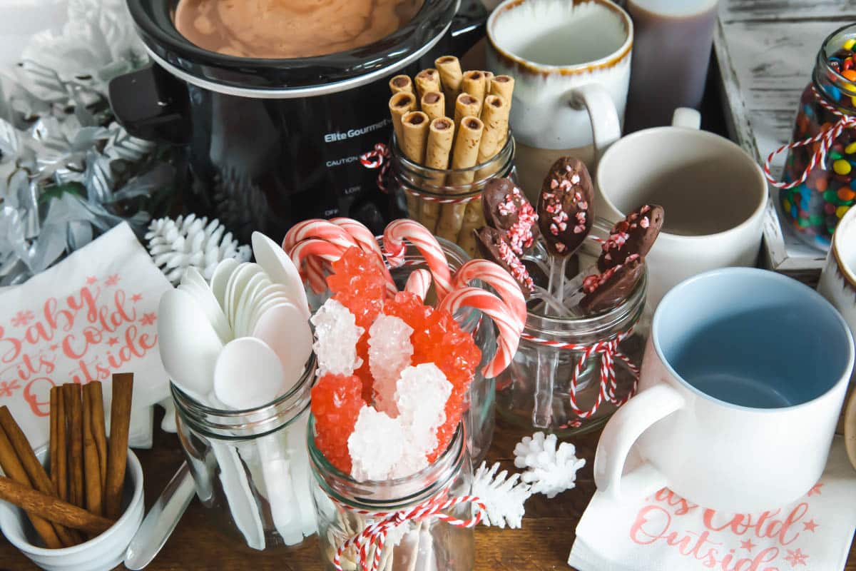 Sauces and toppings for a hot cocoa bar.