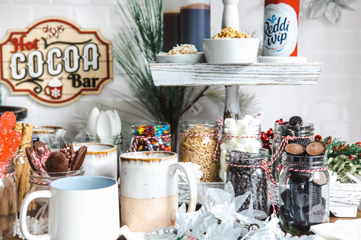Sauces and toppings for a hot cocoa bar.