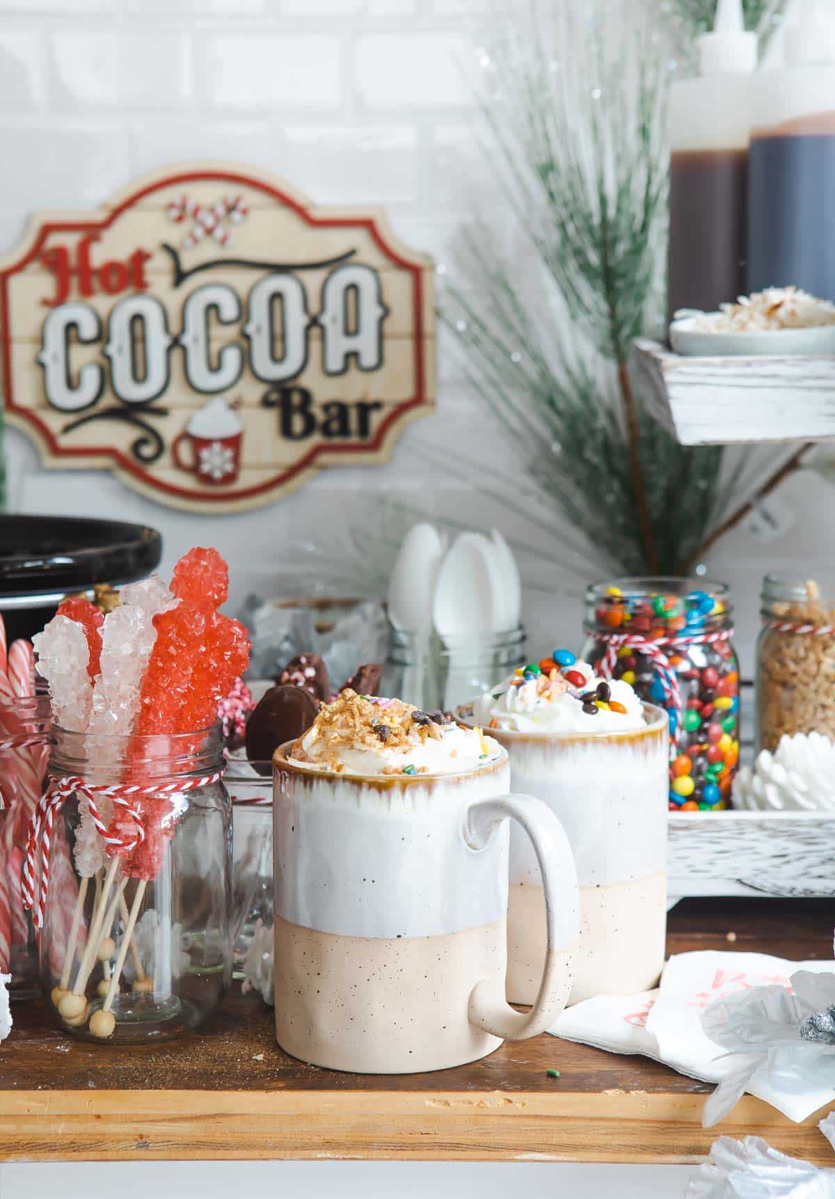 Two cups of hot chocolate at a hot cocoa bar.