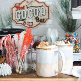 Two cups of hot chocolate at a hot cocoa bar.