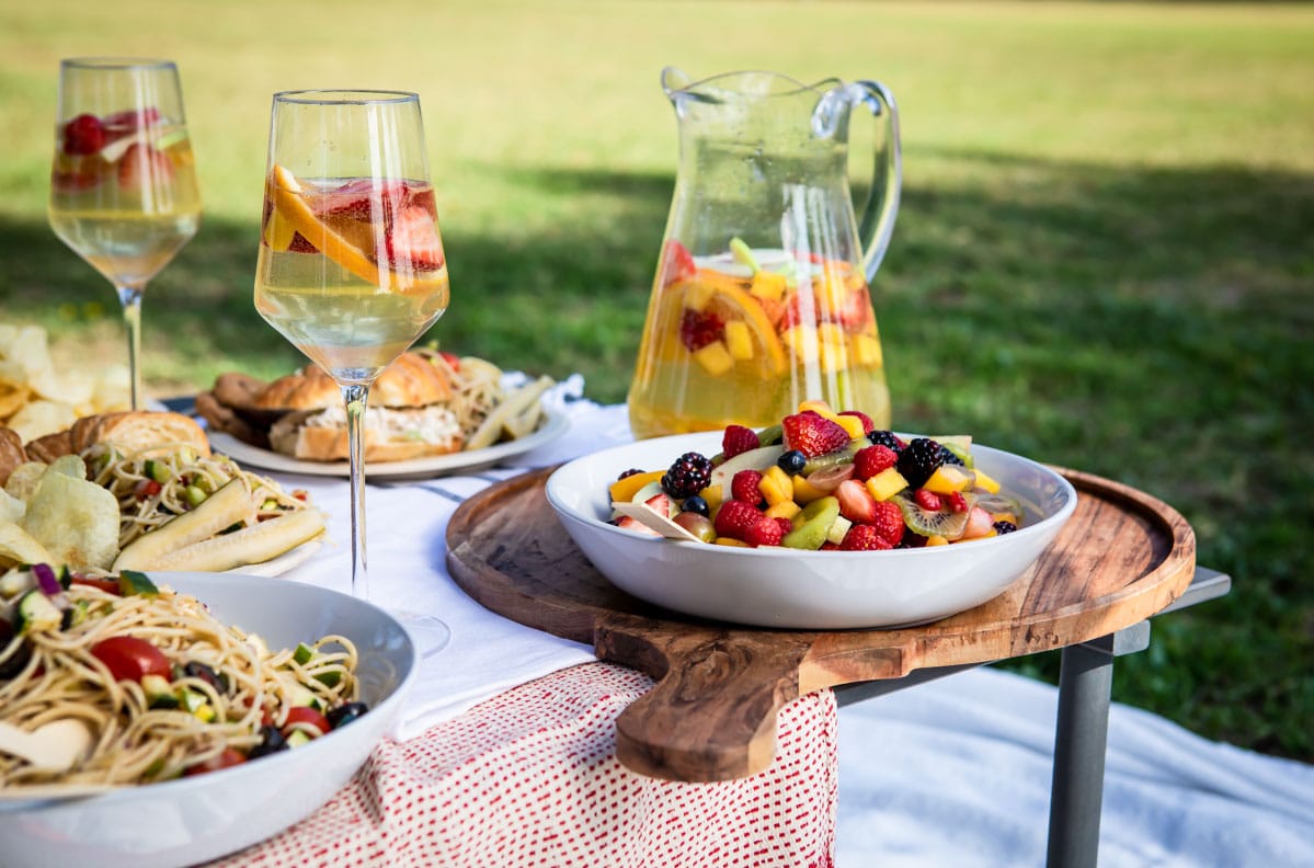A set up of a picnic foods in a park.