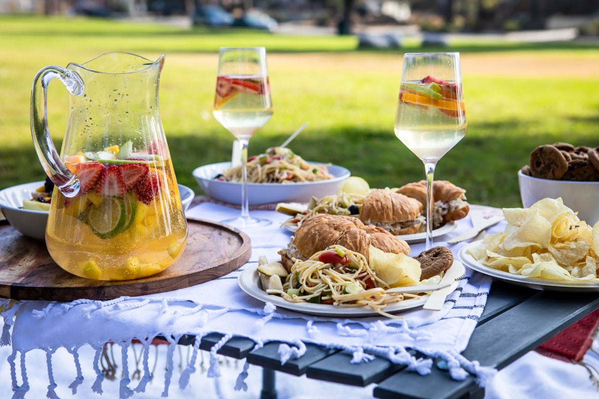 A set up of a picnic foods in a park.