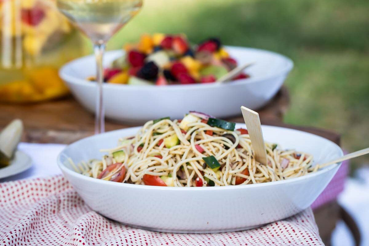 California pasta salad in a white bowl.