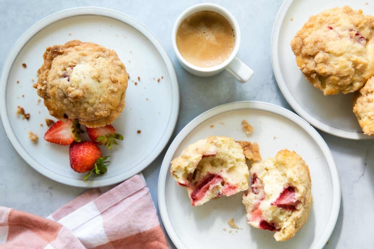 Plates filled with strawberry rhubarb muffins.