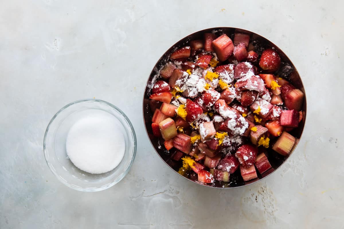 A bowl of filling for strawberry rhubarb pie.