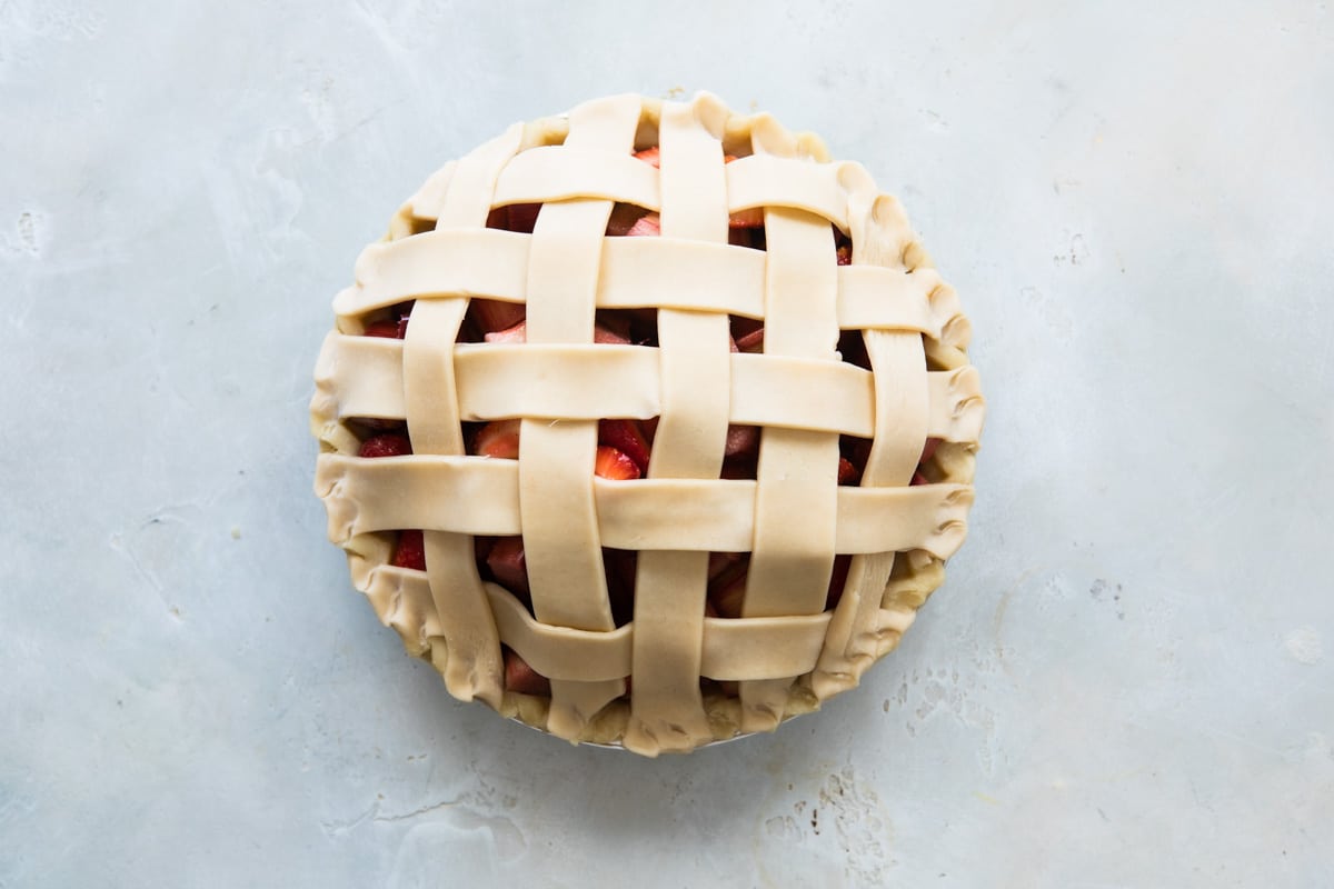 A strawberry rhubarb pie before being baked.