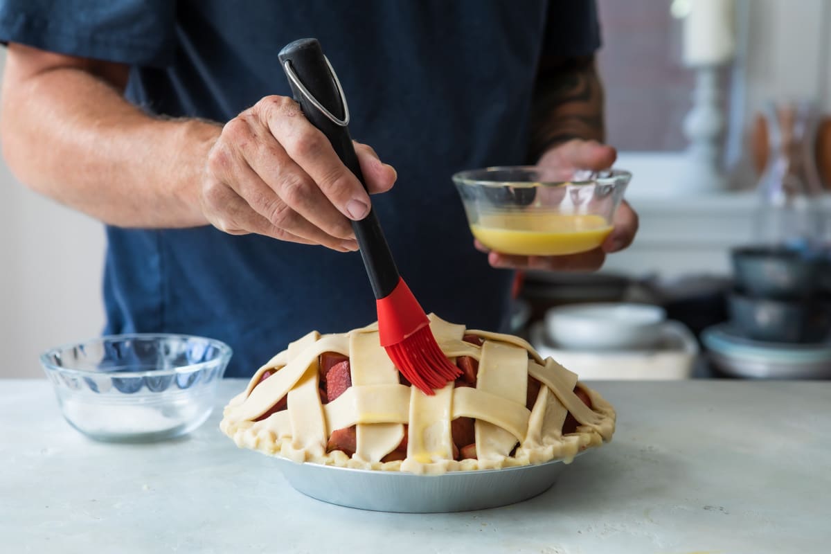An unbaked strawberry rhubarb pie.