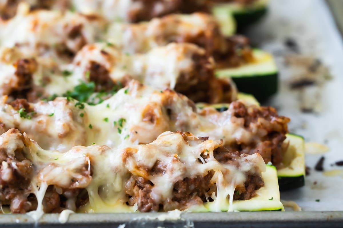 Stuffed zucchini on a baking sheet.